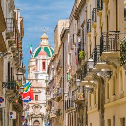 Scenic sight in Trapani with the Church of Saint Francis of Assisi in the background. Sicily, Italy.